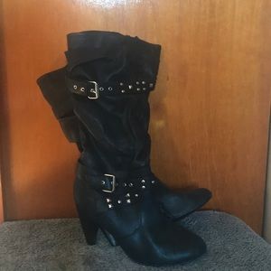 Knee high black boots with studded detail